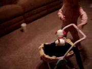 cat in baby doll stroller