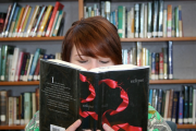 Young adults review books from their local library.